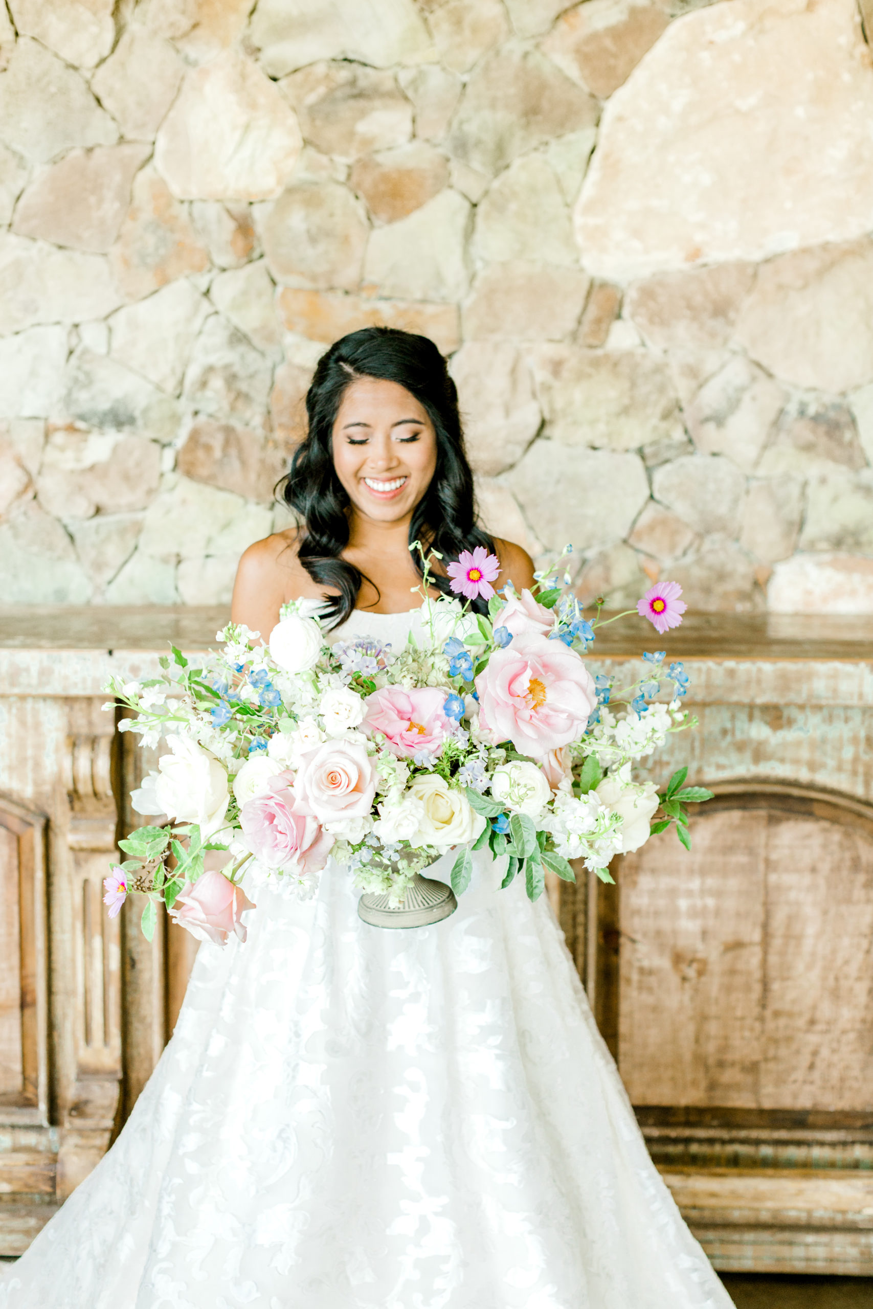 Bride holding large floral bouquet
